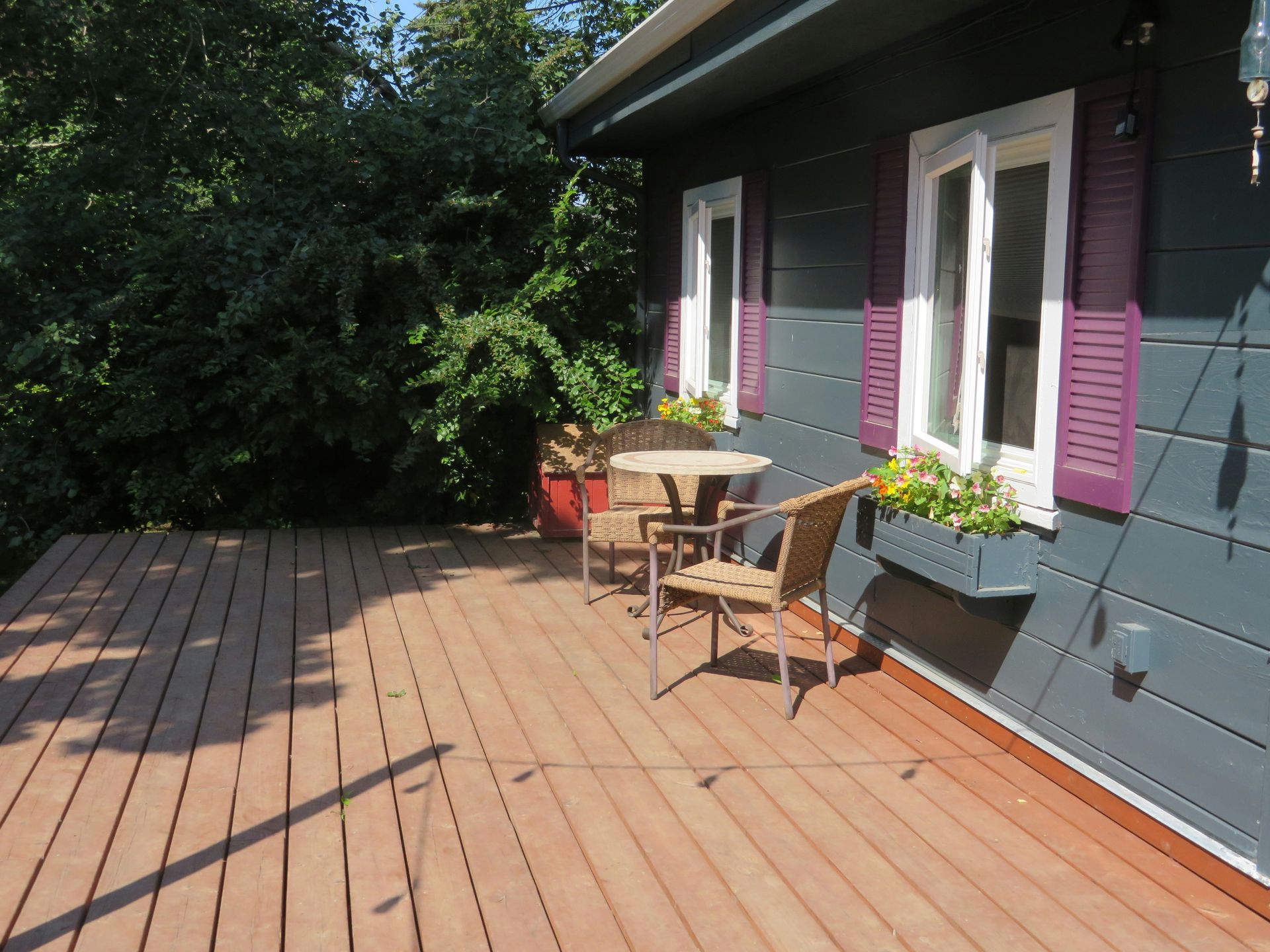 a patio with a table and chairs on it