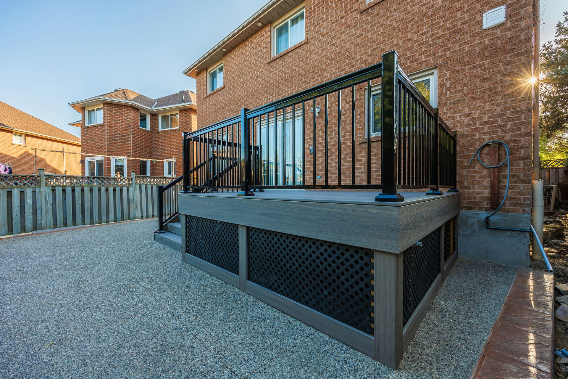 A large hot tub sitting next to a brick building
